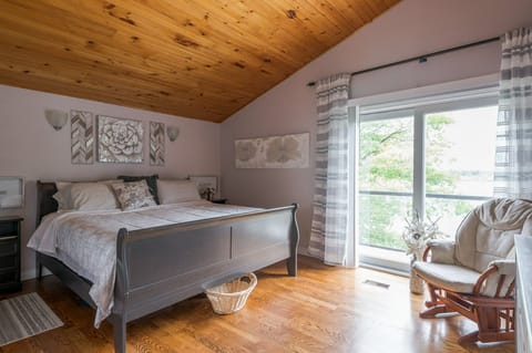 Upstairs king bedroom with sliding doors to the balcony