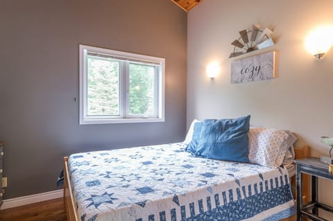 Upstairs queen bedroom with a garden view