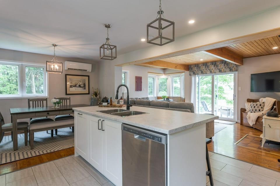 Open concept kitchen with an island, opening onto the dining and living areas