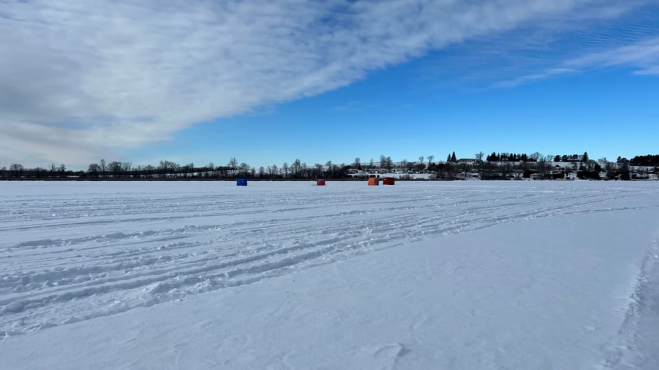 Ice fishing on frozen Rice Lake
